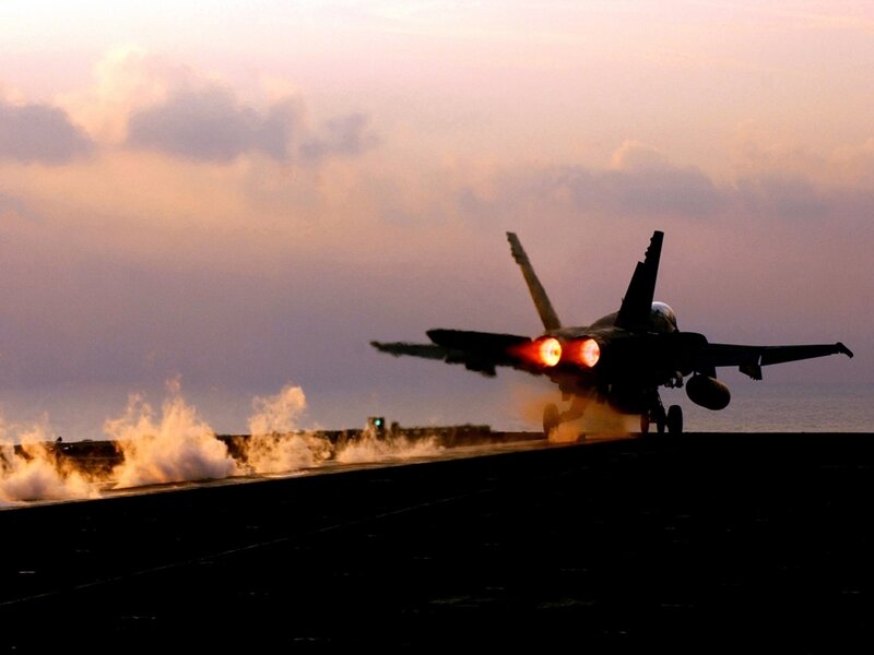 jet taking off from aircraft carrier