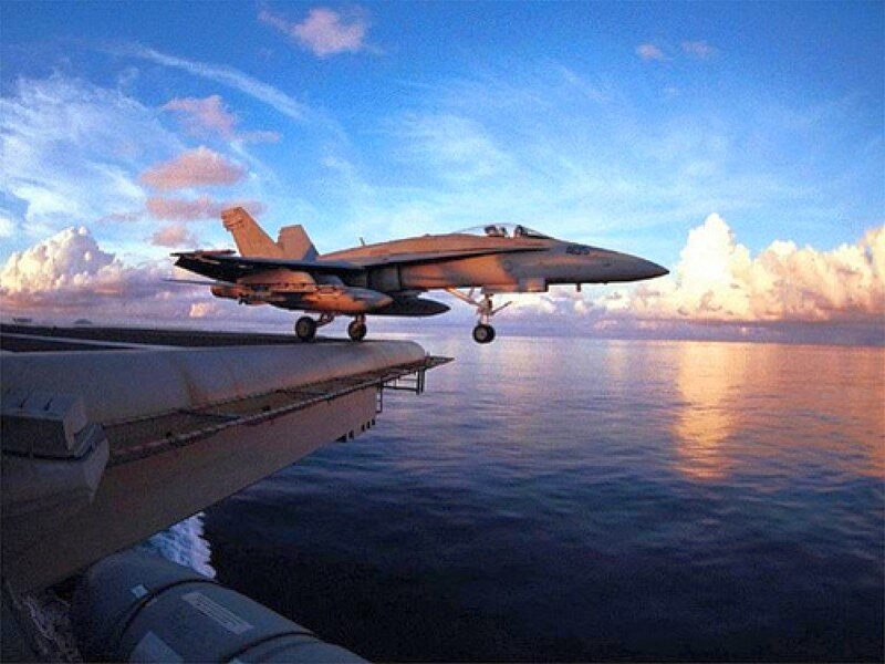 Jet taking off from aircraft carrier