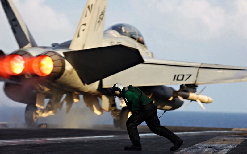 Jet taking off from aircraft carrier