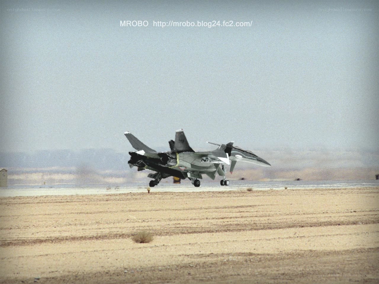 jet taking off from desert runway