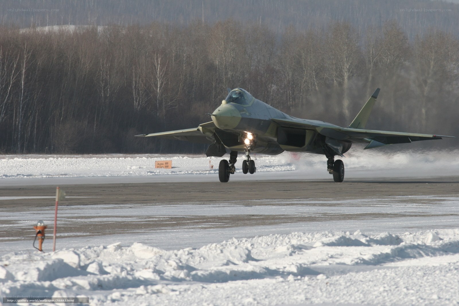 Jet taking off on snowy runway