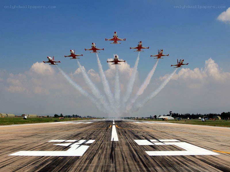Jet team flying over runway