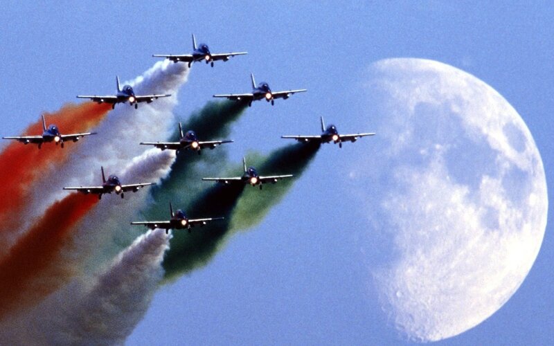 Jets flying in formation with moon