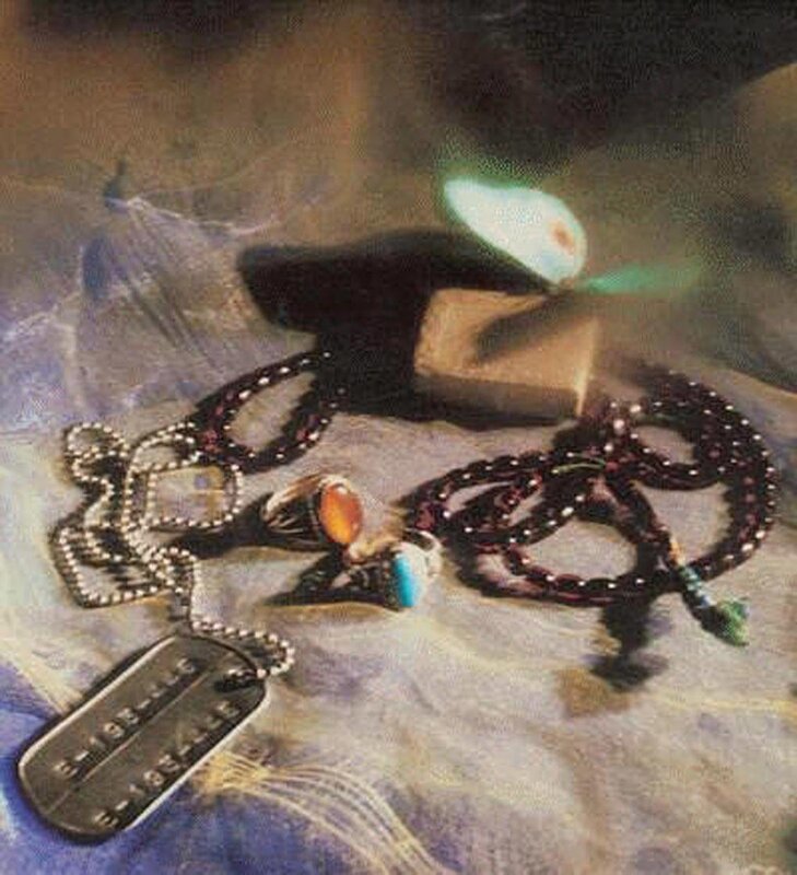 jewelry and dog tag on fabric