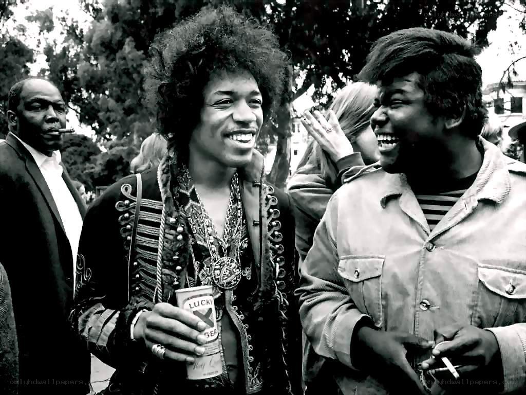 Jimi Hendrix laughing with friends