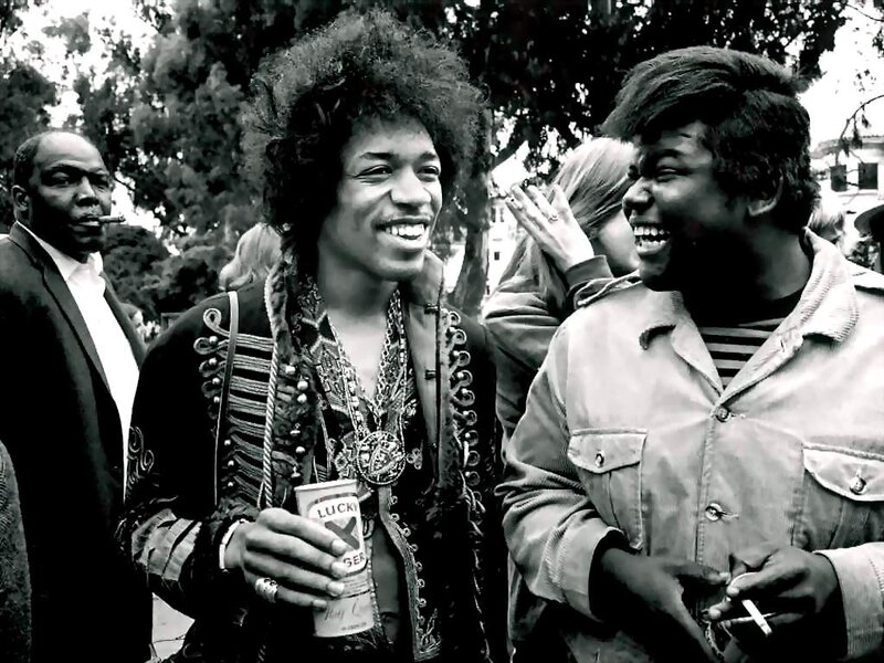 Jimi Hendrix laughing with friends