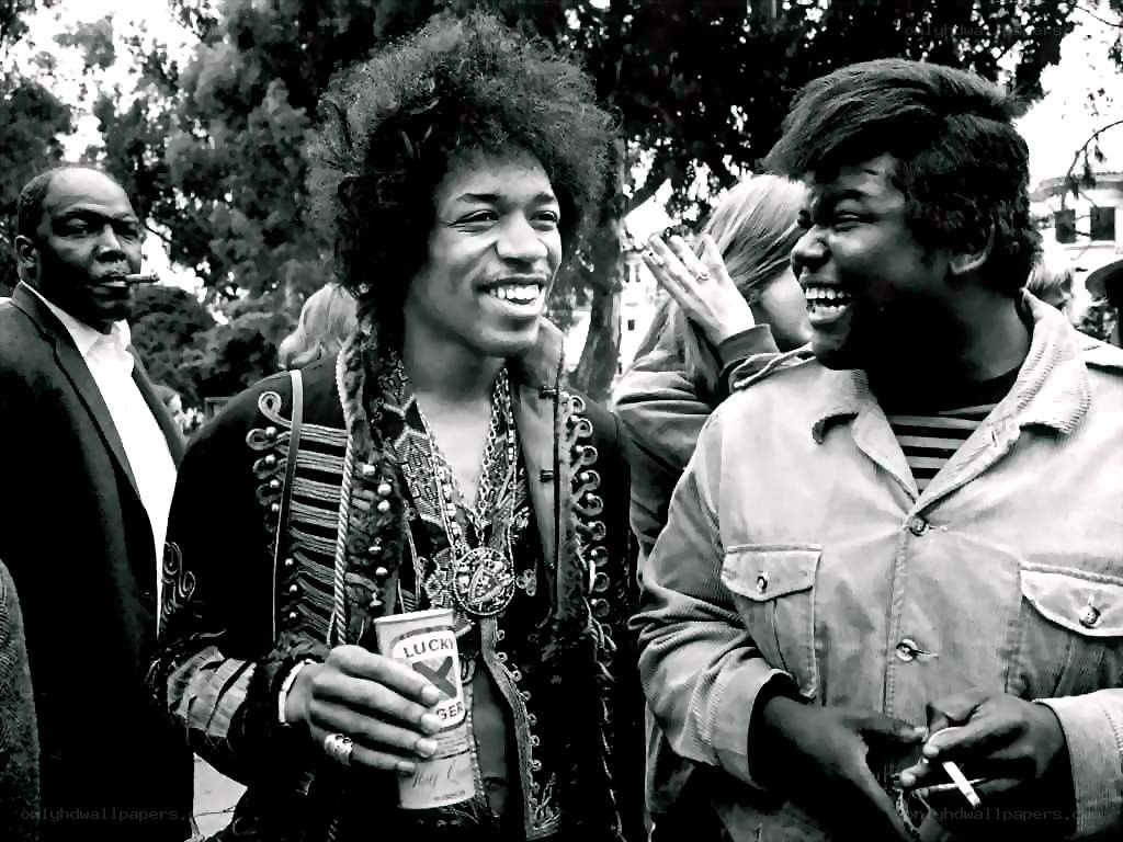 Jimi Hendrix laughing with friends