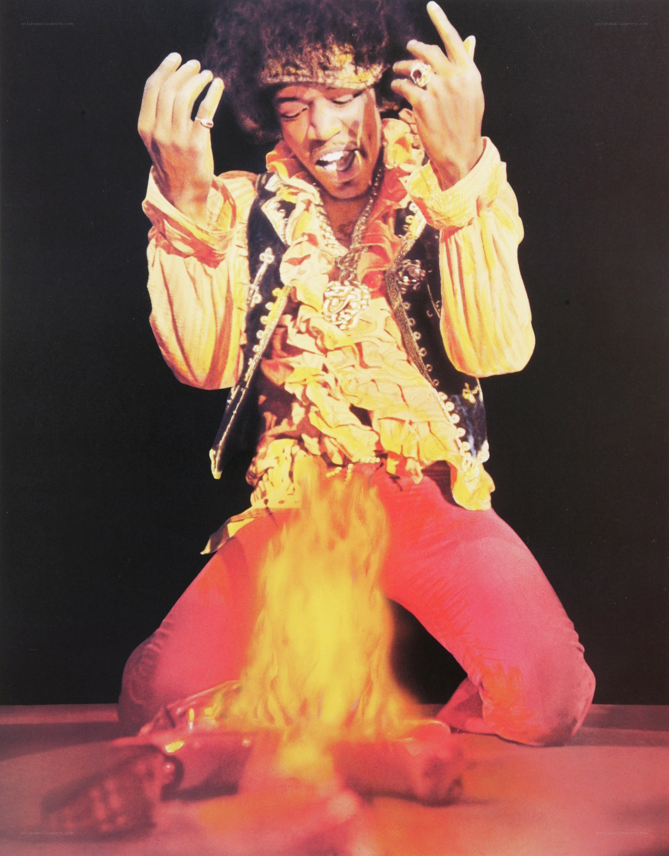 Jimi Hendrix on stage with fire