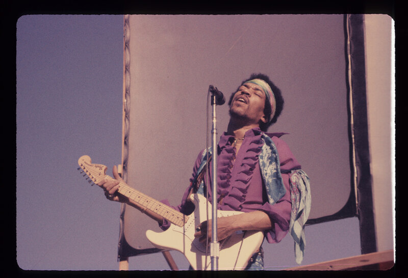 Jimi Hendrix performing on stage