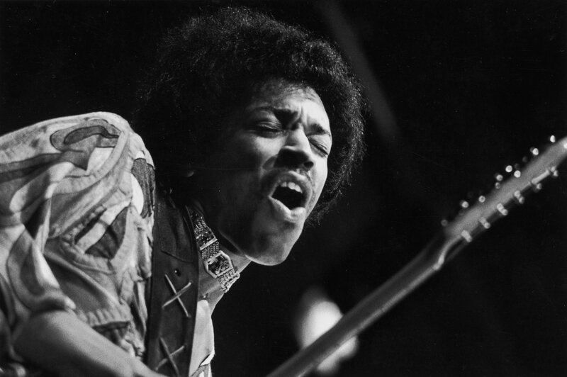 Jimi Hendrix performing on stage