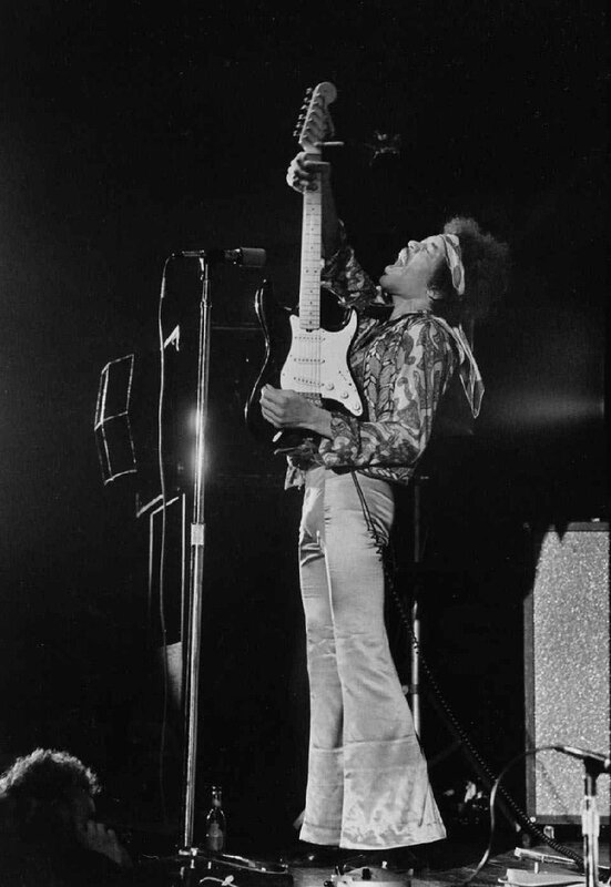Jimi Hendrix performing on stage