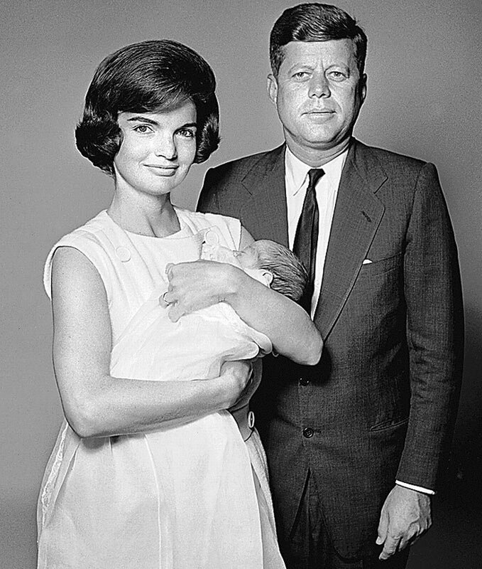 John and Jackie Kennedy with child