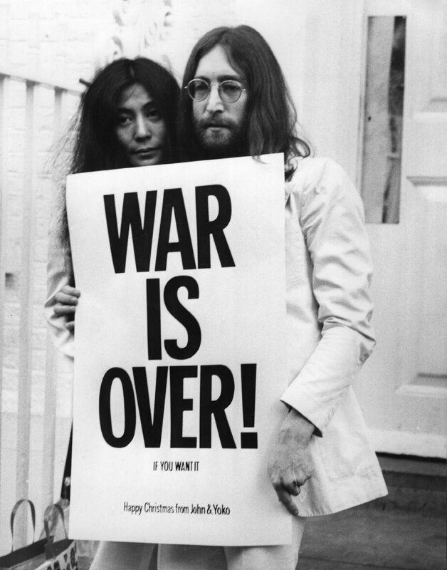 John and Yoko holding 'War Is Over' sign