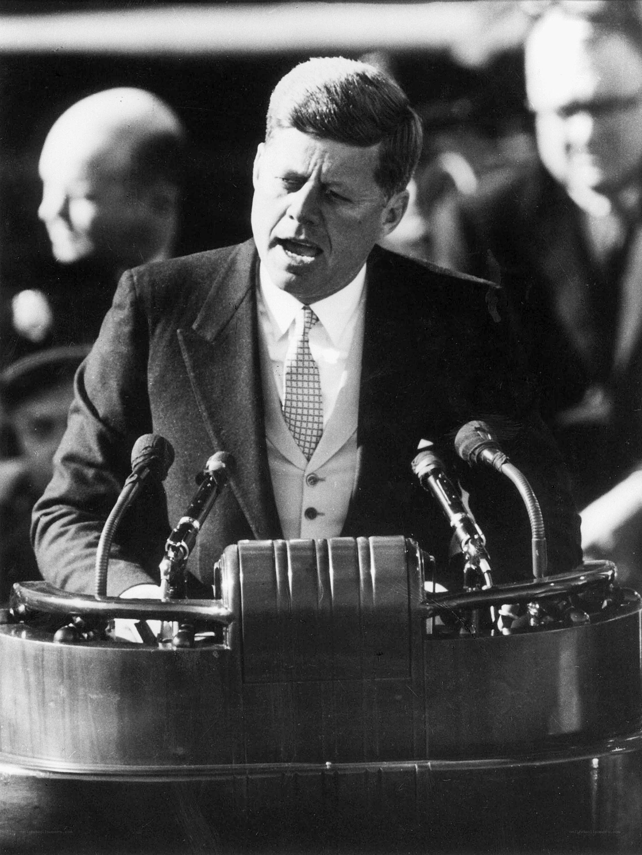 John F. Kennedy speaking at podium