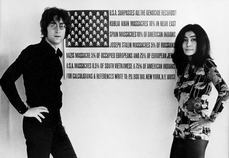 John Lennon and Yoko Ono with protest art