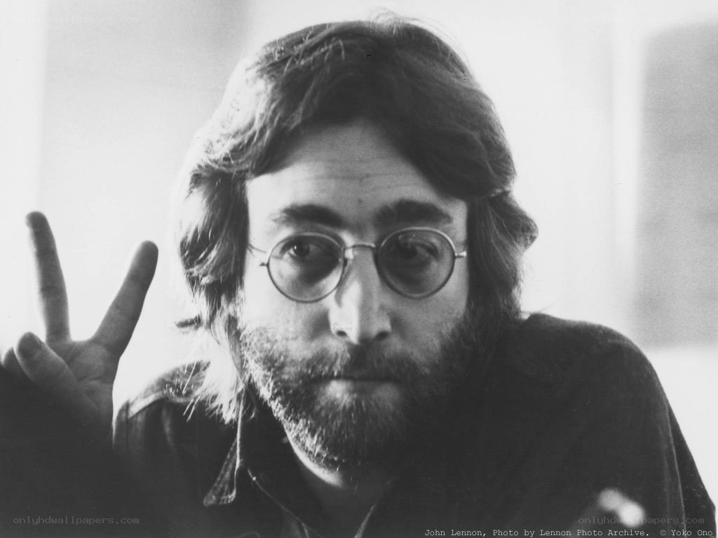 John Lennon making peace sign