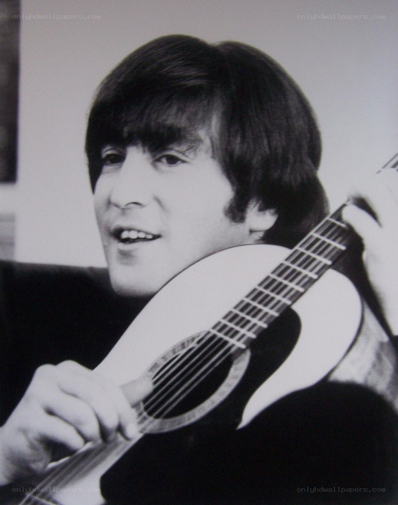 John Lennon playing guitar