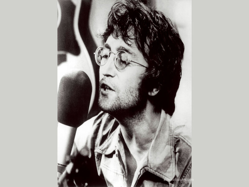 John Lennon singing into a microphone