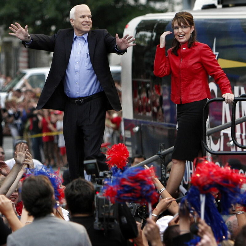 John McCain and Sarah Palin wave to crowd