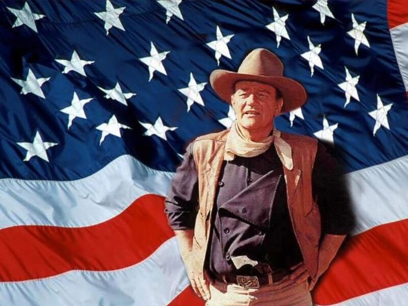 John Wayne in front of American flag