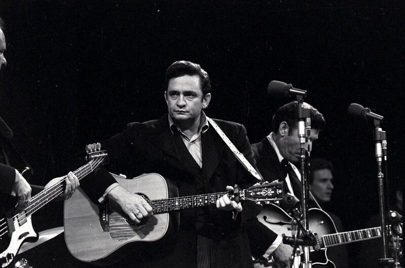Johnny Cash performing on stage