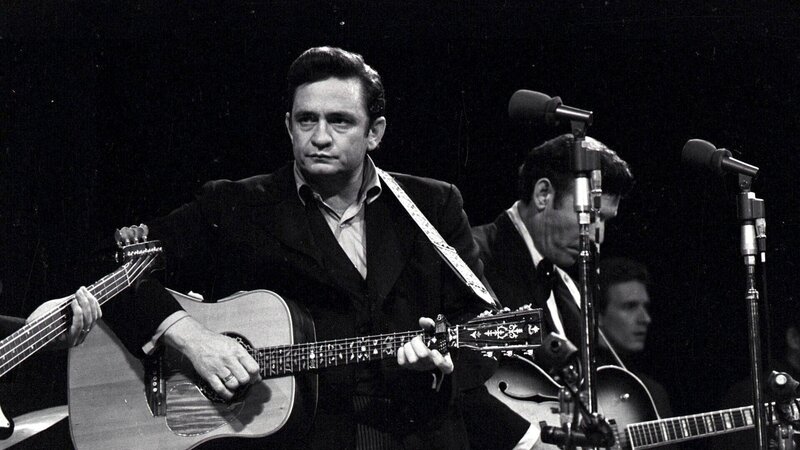 Johnny Cash performing on stage
