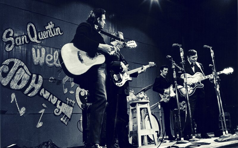 Johnny Cash performs on stage