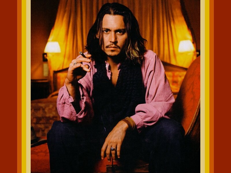 Johnny Depp holding a cigarette