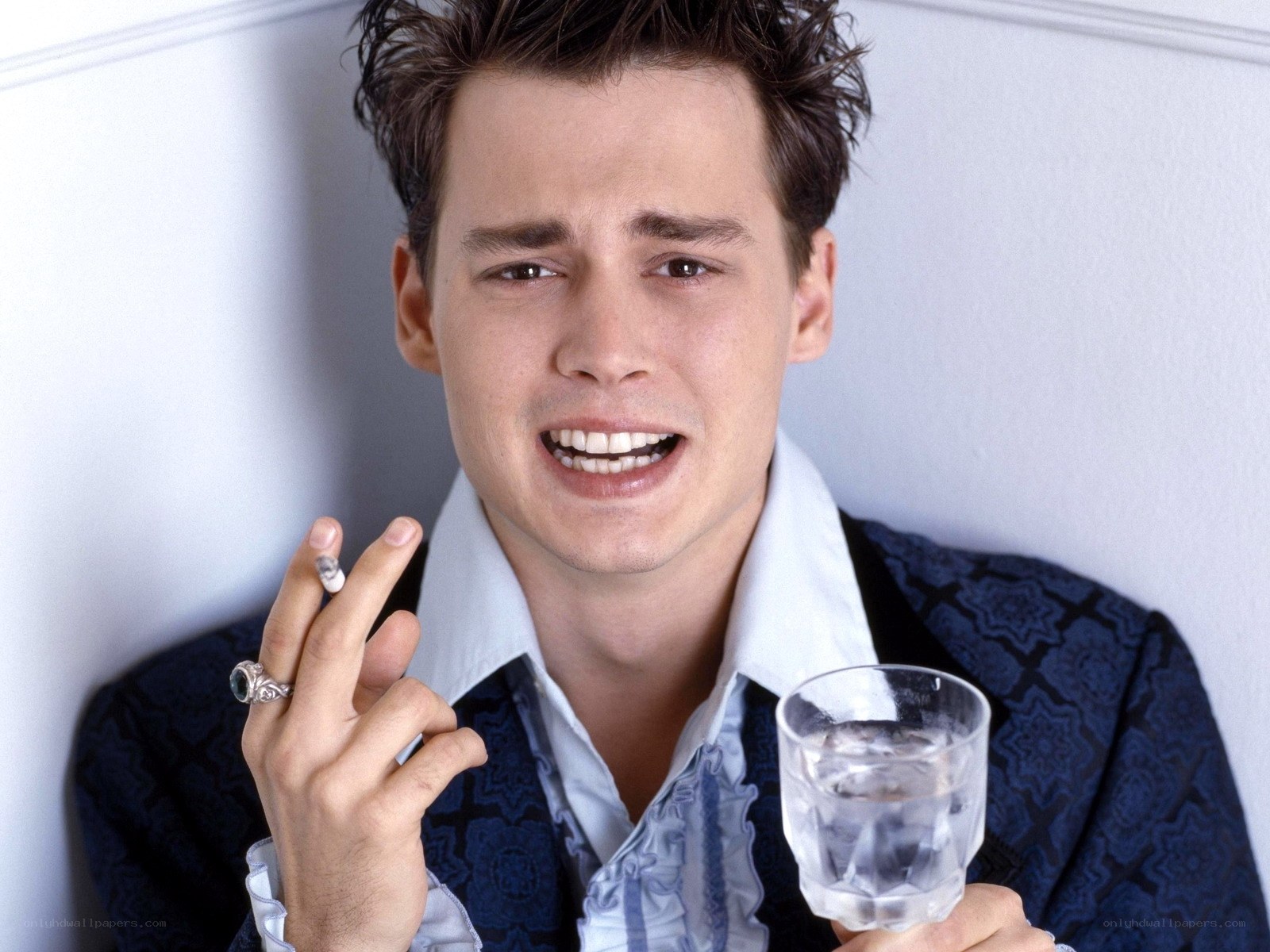 Johnny Depp holding drink and cigarette