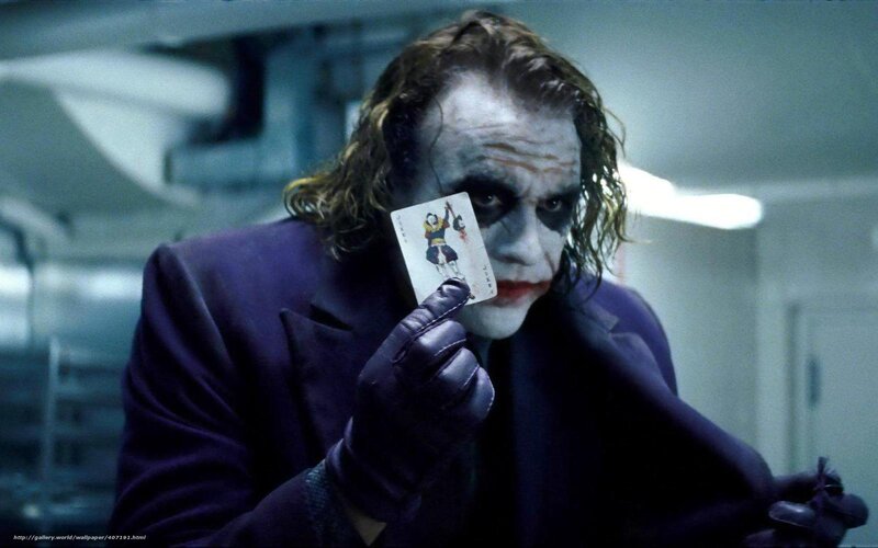 Joker holding a card