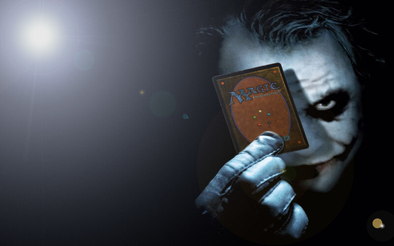 Joker holding a magic card