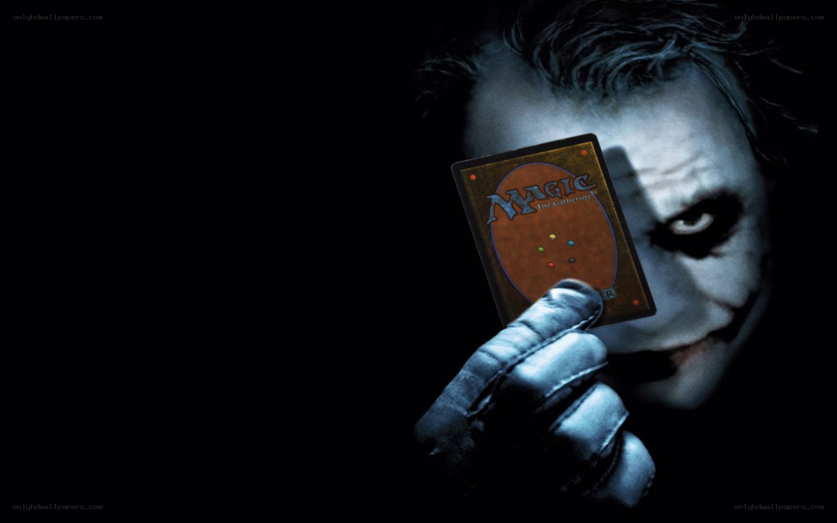 Joker holding a magic card