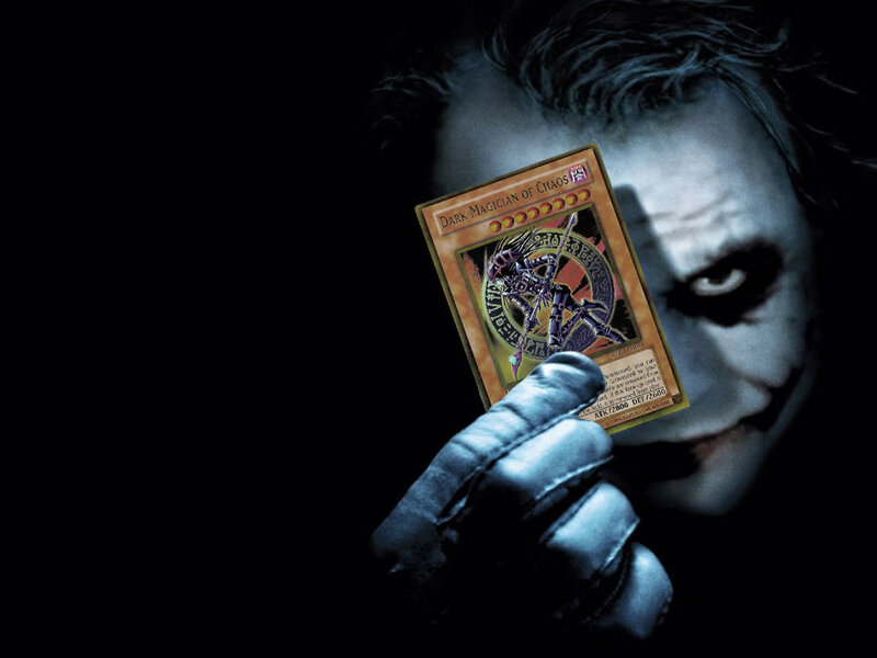 Joker holding a Yu-Gi-Oh card
