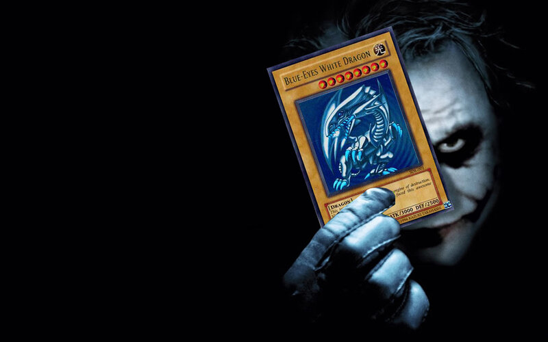 Joker holding Blue-Eyes White Dragon