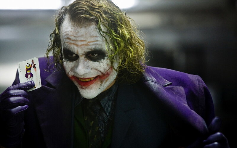 Joker Holding Card — Purple, Dramatic, Photograph, Gloves