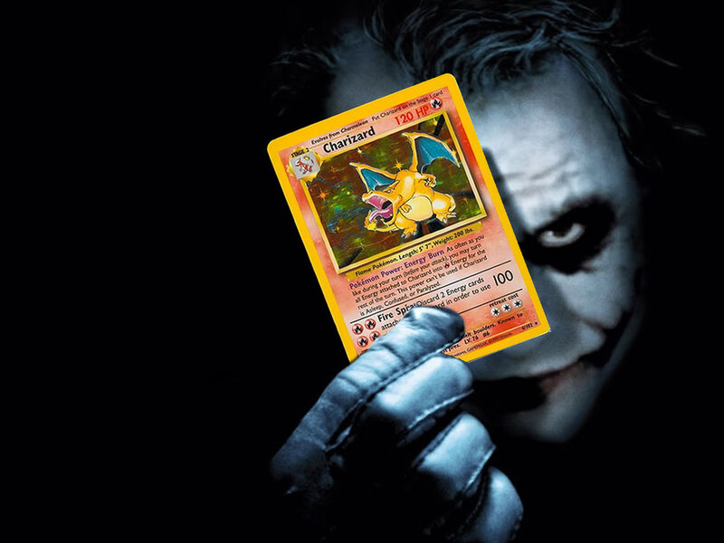 Joker holding Charizard card