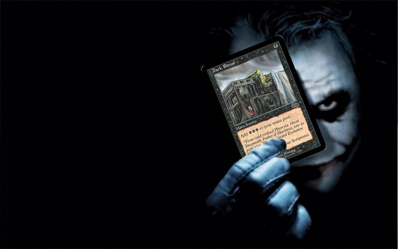 Joker holding Dark Ritual card
