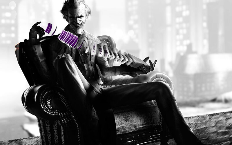 Joker in a chair with cards