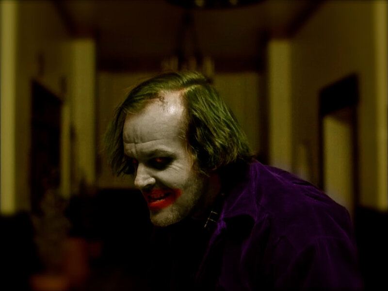 Joker in a dimly lit room