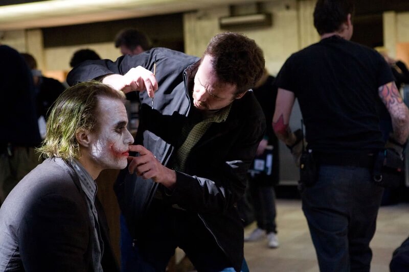 Joker makeup application on set
