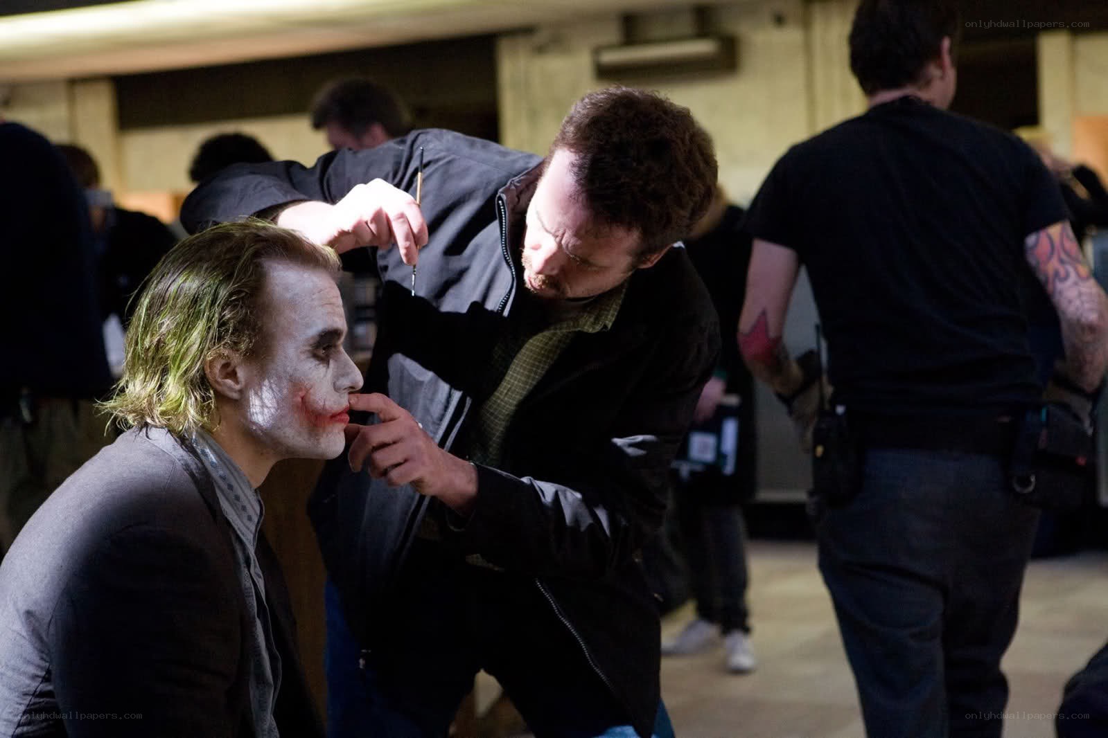 Joker makeup application on set