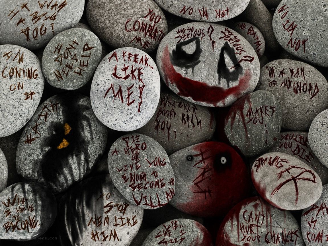 Joker-themed rocks with quotes