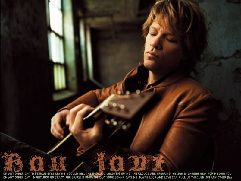 Jon Bon Jovi playing guitar