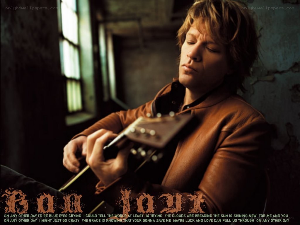 Jon Bon Jovi playing guitar