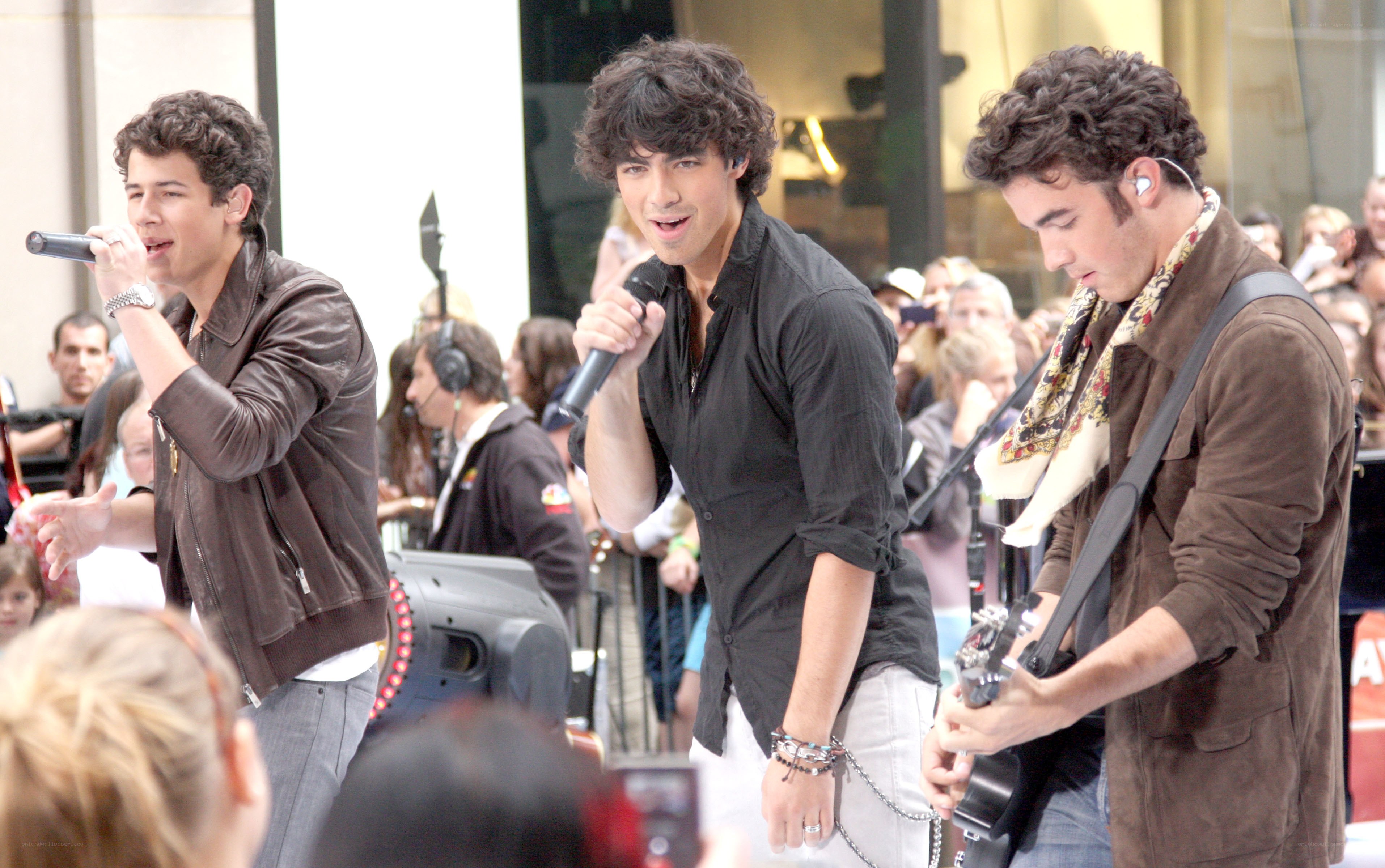 Jonas Brothers performing on stage
