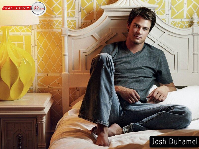 Josh Duhamel on a bed