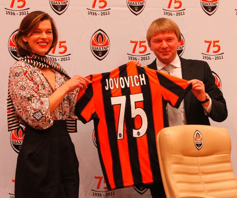 Jovovich with football jersey
