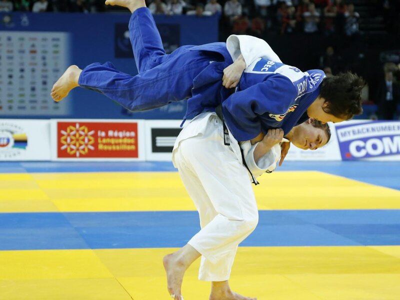 Judoka Performing Throw — Yellow