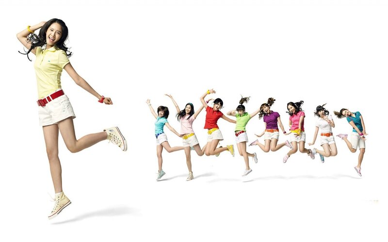 jumping women in colorful clothes