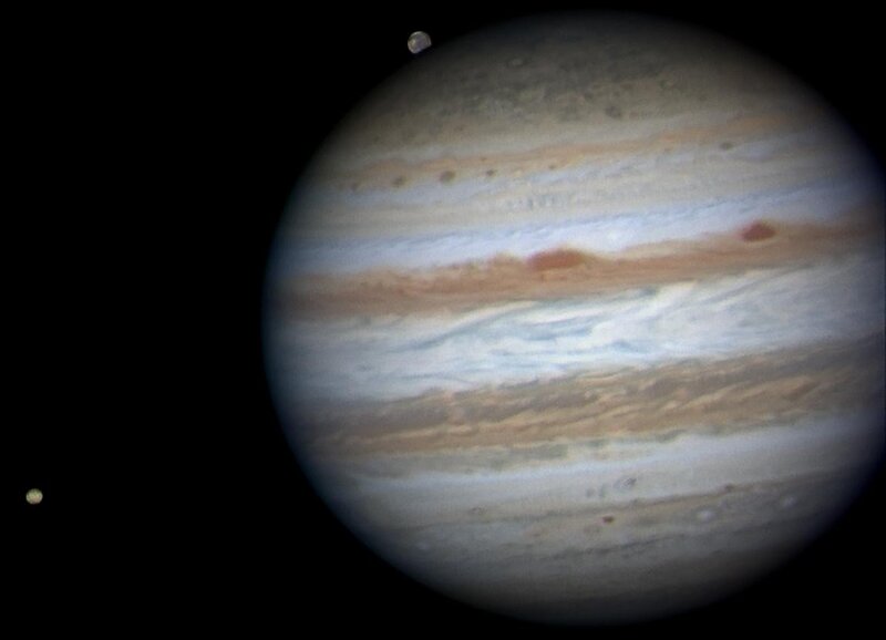 Jupiter and Its Moons — Brown, Dramatic, Photograph, Planet